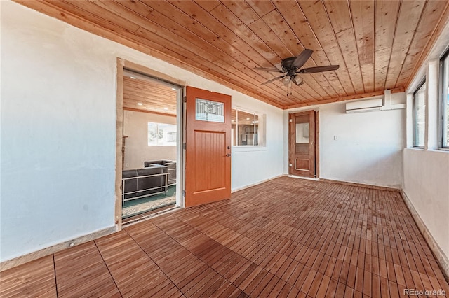 7727 County Road 521, Walsenburg, CO 81089 - interior space with a wall mounted air conditioner, wooden ceiling, and a ceiling fan