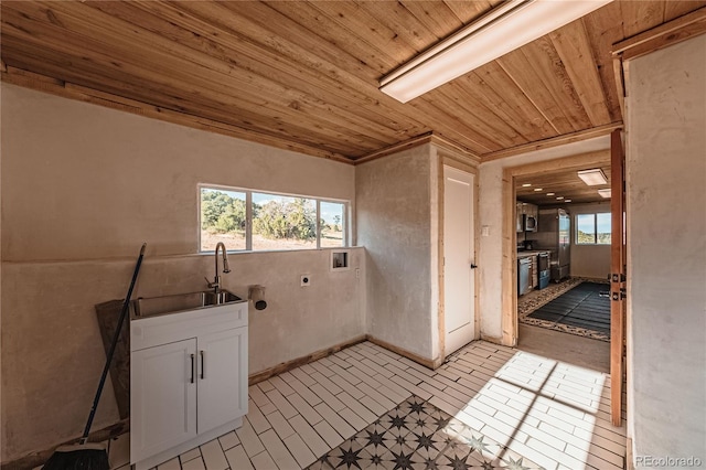 clothes washing area featuring hookup for a washing machine, light tile patterned floors, sink, wooden ceiling, and hookup for an electric dryer