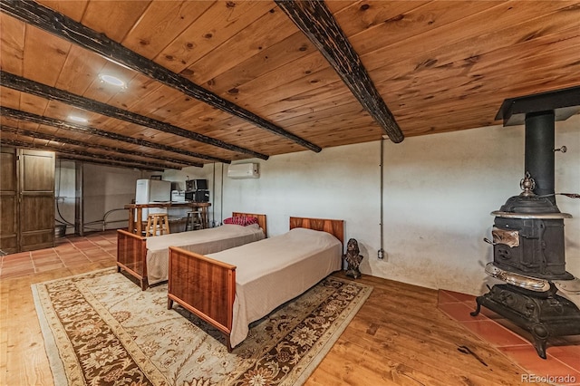 bedroom with a wall unit AC, wood ceiling, a wood stove, light hardwood / wood-style floors, and beamed ceiling