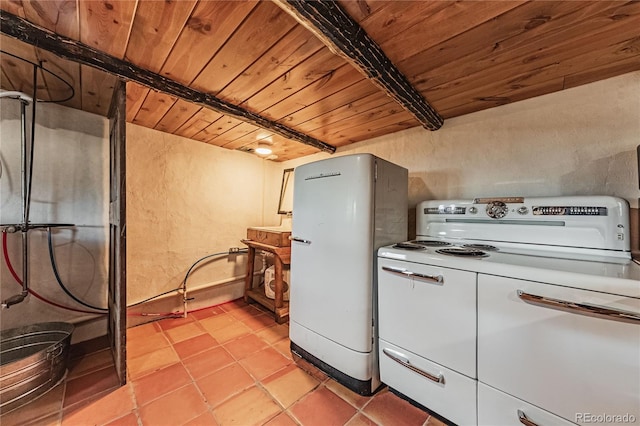 kitchen featuring white fridge, light tile patterned floors, washer / dryer, wood ceiling, and beam ceiling