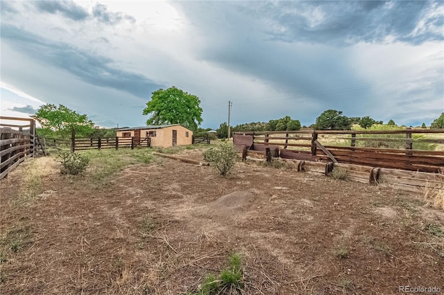 view of yard with a rural view