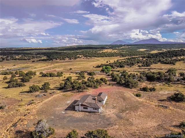 birds eye view of property with a mountain view