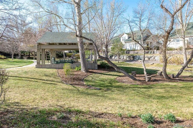 surrounding community with a yard and a gazebo