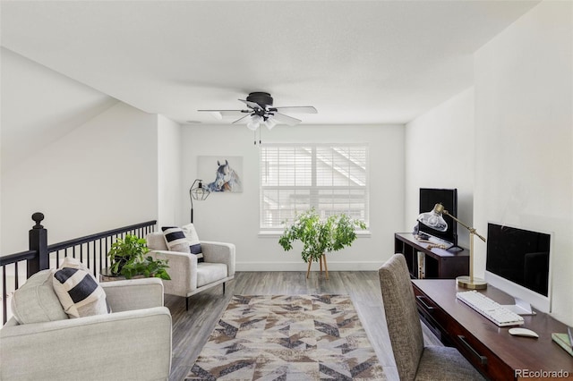 office with ceiling fan, baseboards, and wood finished floors