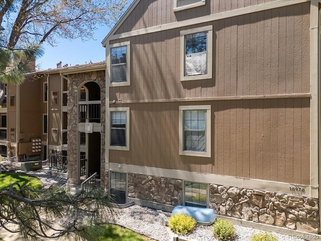 view of property exterior featuring stone siding