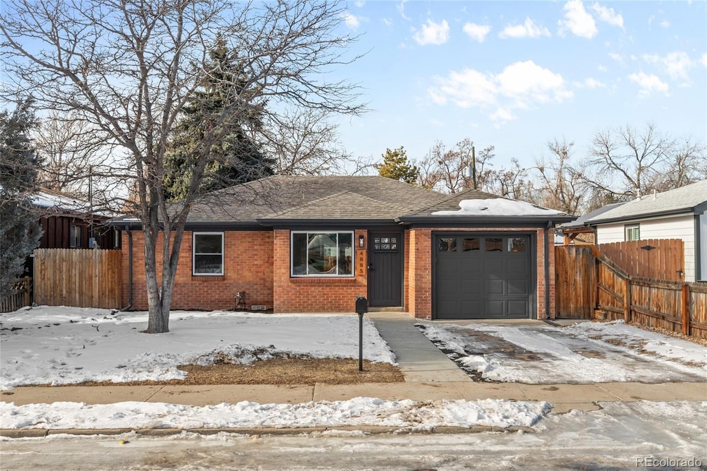 single story home featuring a garage