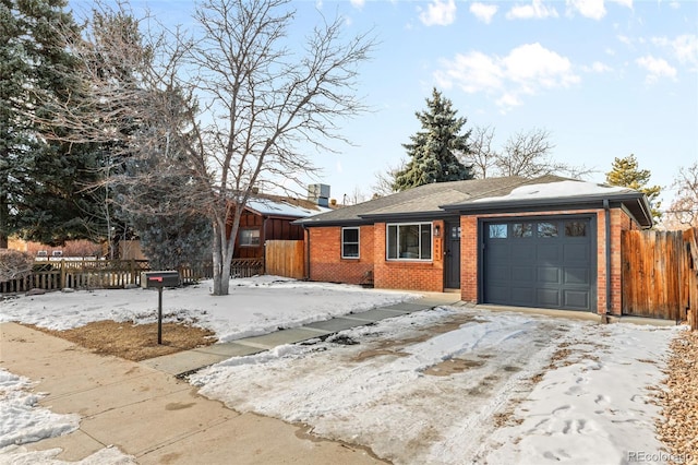 ranch-style home featuring a garage