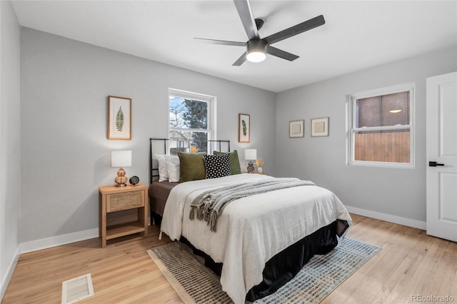 bedroom with light wood-type flooring and ceiling fan