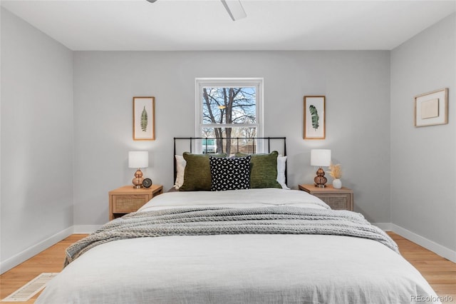 bedroom featuring ceiling fan and light hardwood / wood-style floors