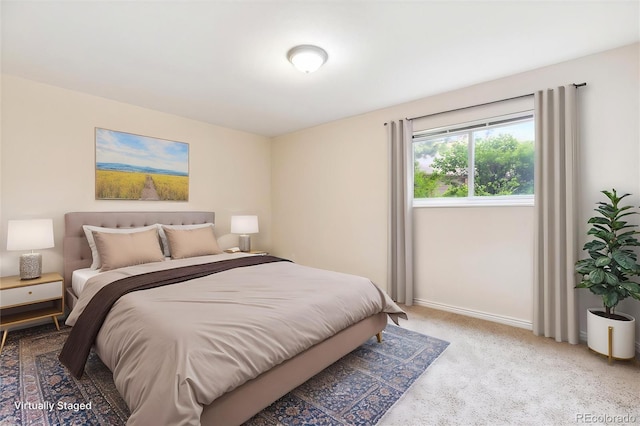 carpeted bedroom with baseboards