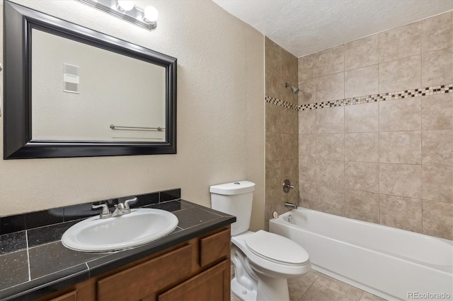 full bath featuring toilet, bathtub / shower combination, vanity, a textured ceiling, and a textured wall