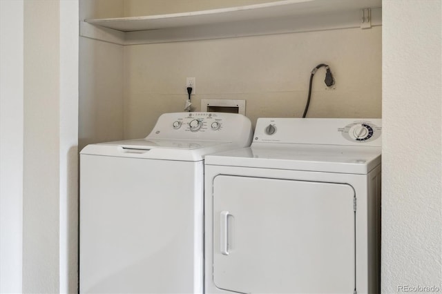laundry room featuring washing machine and dryer