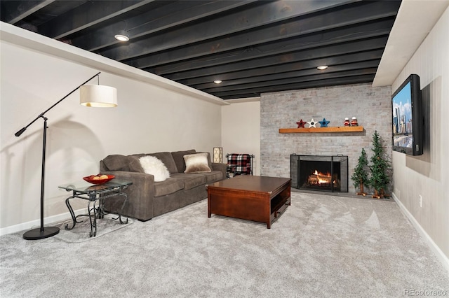 27436 Kennedy Gulch Rd, Conifer, CO 80433 - carpeted living room featuring a brick fireplace and baseboards
