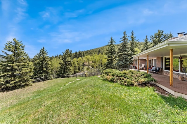 27436 Kennedy Gulch Rd, Conifer, CO 80433 - view of yard featuring a forest view and a wooden deck