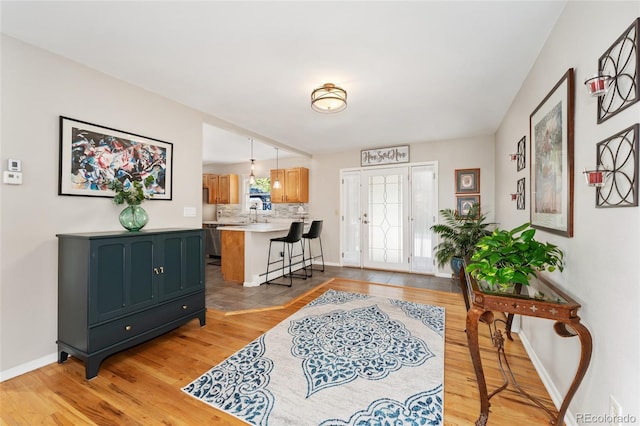 27436 Kennedy Gulch Rd, Conifer, CO 80433 - foyer entrance featuring light wood-style flooring and baseboards