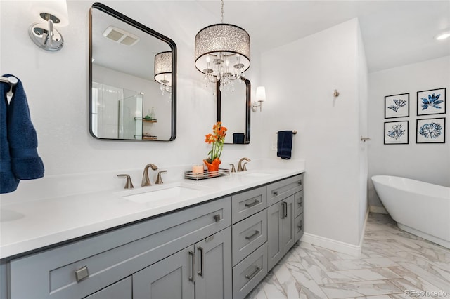 27436 Kennedy Gulch Rd, Conifer, CO 80433 - bathroom featuring marble look tiles, double vanity, a freestanding tub, and a chandelier