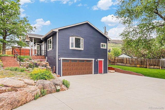 401 N Columbine St, Golden, CO 80403 - view of side of property featuring driveway, stairway, and an attached garage