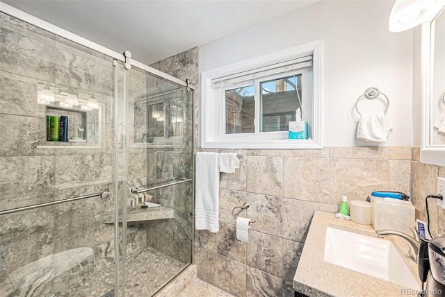 401 N Columbine St, Golden, CO 80403 - full bathroom with vanity, a stall shower, and tile walls