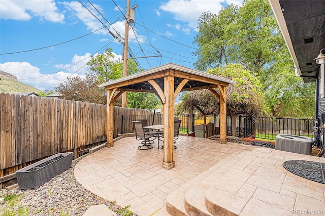 401 N Columbine St, Golden, CO 80403 - fenced backyard with a gazebo, central AC unit, outdoor dining area, and a patio area