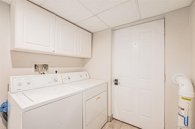 401 N Columbine St, Golden, CO 80403 - laundry area with washer and clothes dryer, cabinet space, and light tile patterned flooring