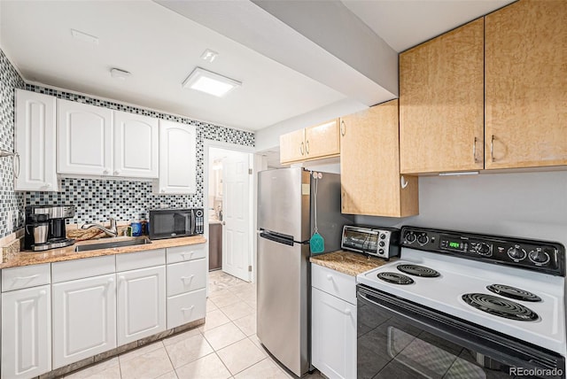 401 N Columbine St, Golden, CO 80403 - kitchen with range with electric cooktop, black microwave, a sink, and white cabinets