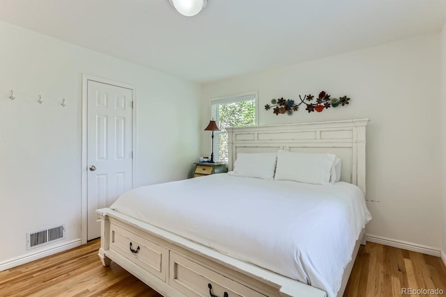 bedroom with light wood-type flooring