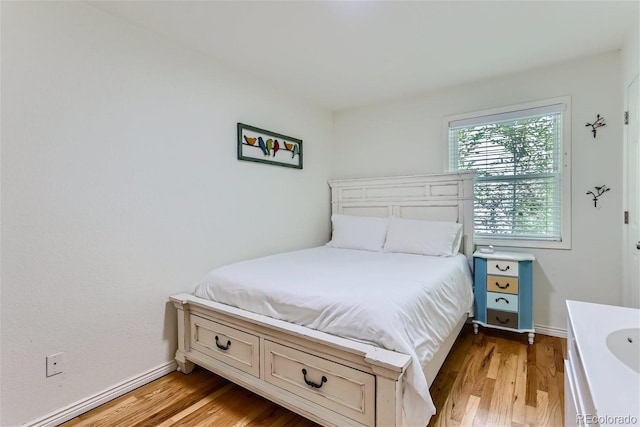 bedroom featuring light wood-type flooring