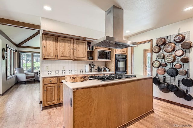 6663 S Prescott Way, Littleton, CO 80120 - kitchen featuring island exhaust hood, stainless steel gas stovetop, light countertops, a center island, and light wood finished floors