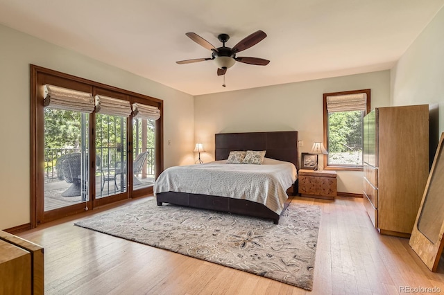 6663 S Prescott Way, Littleton, CO 80120 - bedroom featuring access to outside, multiple windows, wood-type flooring, and baseboards