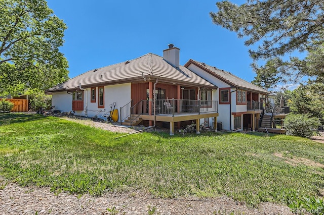 6663 S Prescott Way, Littleton, CO 80120 - rear view of house featuring a chimney, a wooden deck, and a tiled roof