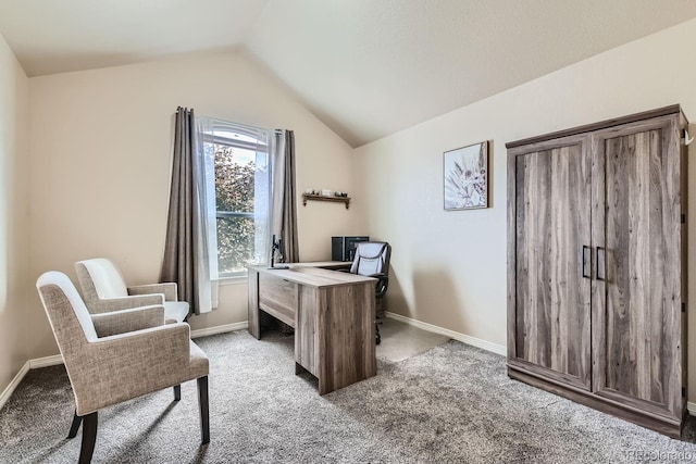 carpeted office with vaulted ceiling