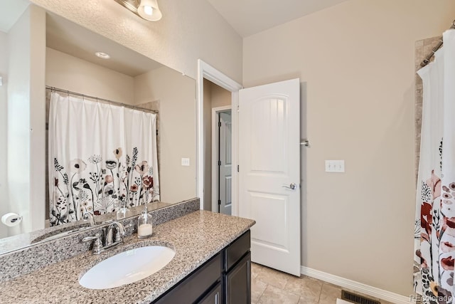 bathroom featuring vanity and a shower with shower curtain