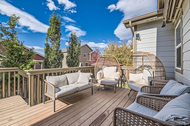 deck with an outdoor hangout area