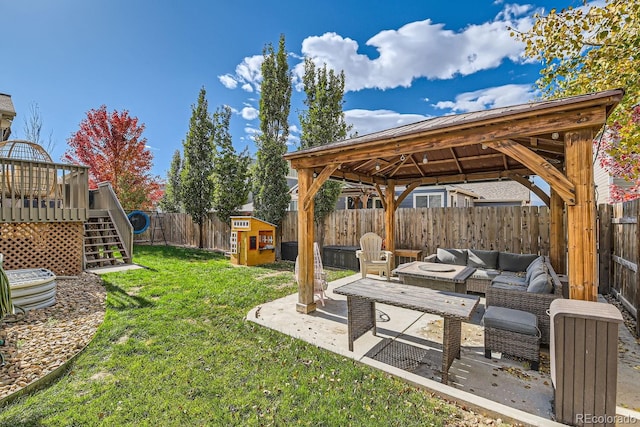 view of yard featuring a gazebo, a deck, and outdoor lounge area