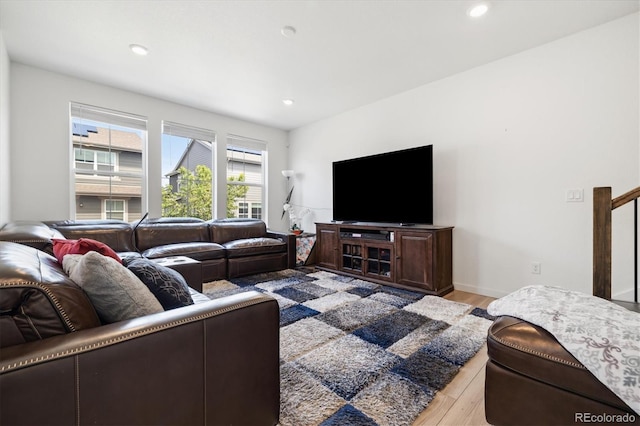 10983 Uvalda St, Commerce City, CO 80022 - living area featuring light wood-style flooring and recessed lighting