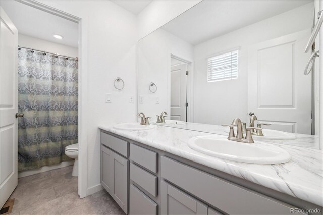 10983 Uvalda St, Commerce City, CO 80022 - full bath with toilet and double vanity