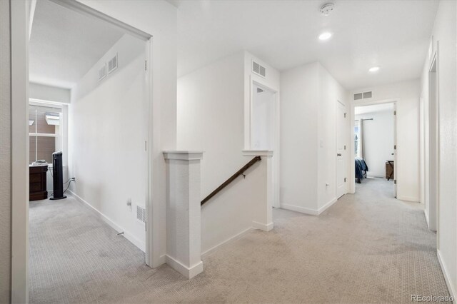 10983 Uvalda St, Commerce City, CO 80022 - hallway featuring an upstairs landing, carpet floors, baseboards, and recessed lighting