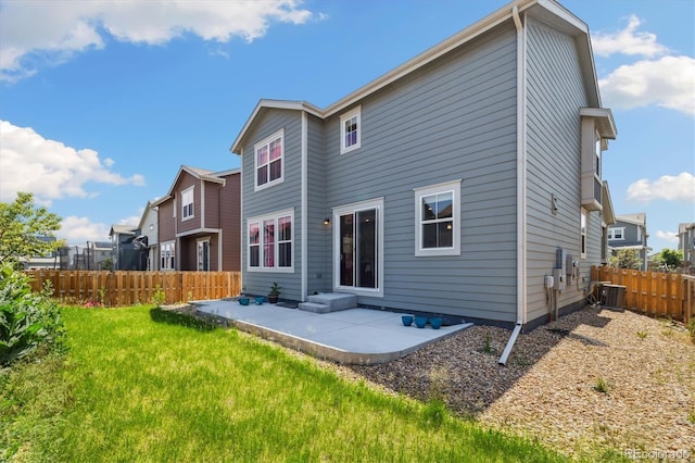 10983 Uvalda St, Commerce City, CO 80022 - rear view of house featuring a patio area and central AC