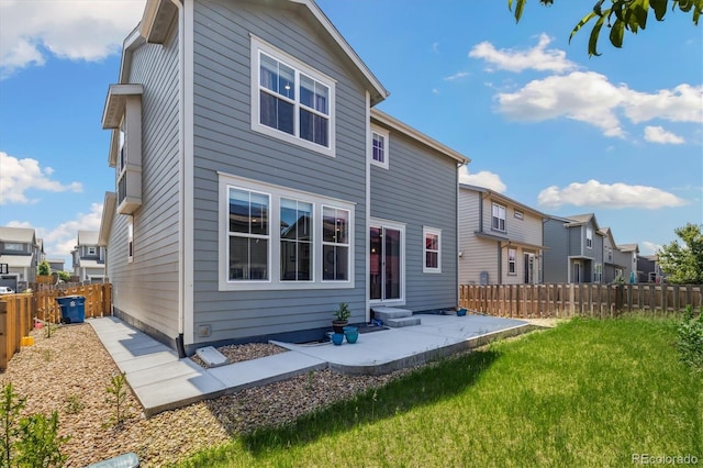 10983 Uvalda St, Commerce City, CO 80022 - back of house featuring a patio and a residential view