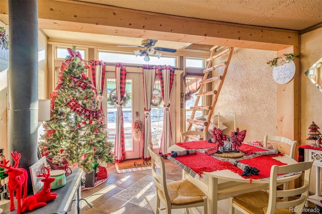 tiled dining area featuring ceiling fan