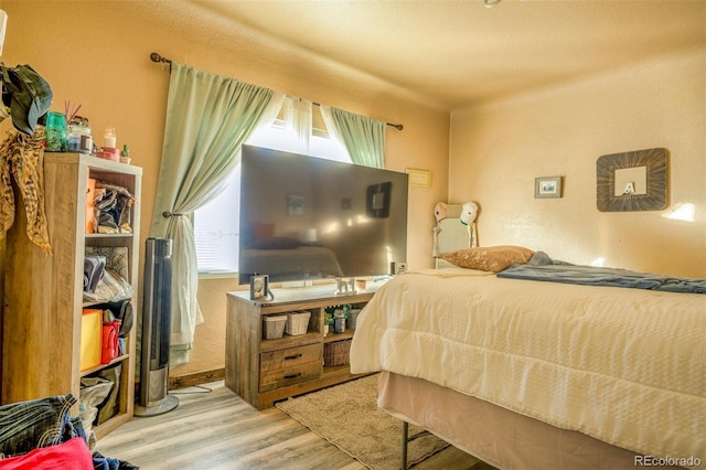 bedroom with wood-type flooring