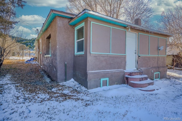 view of snow covered property