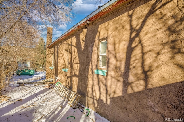 view of side of home with a patio