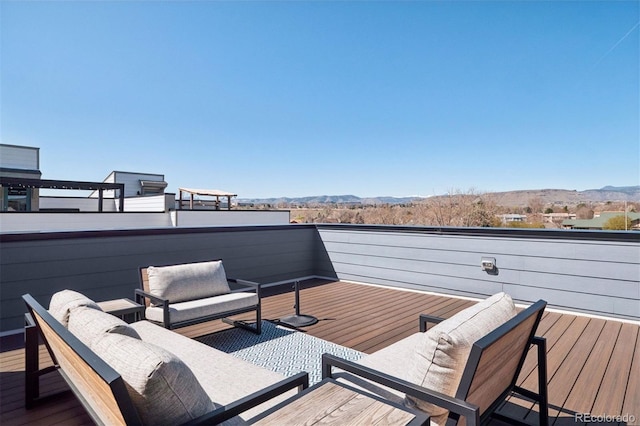 12283 W 57th Ln, Arvada, CO 80002 - deck featuring a mountain view and an outdoor living space