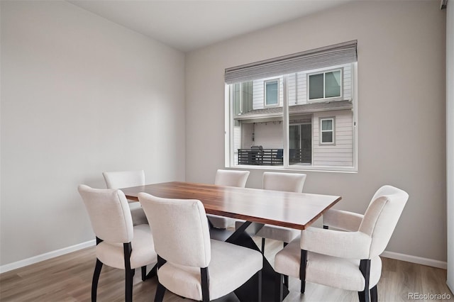 12283 W 57th Ln, Arvada, CO 80002 - dining room with baseboards and wood finished floors