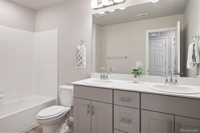 12283 W 57th Ln, Arvada, CO 80002 - bathroom with double vanity and shower / tub combination
