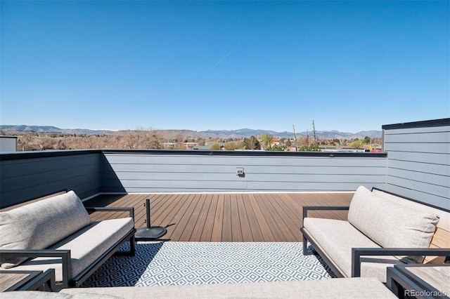 12283 W 57th Ln, Arvada, CO 80002 - deck featuring a mountain view and outdoor lounge area