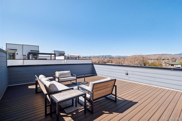 12283 W 57th Ln, Arvada, CO 80002 - wooden deck featuring a mountain view and an outdoor living space