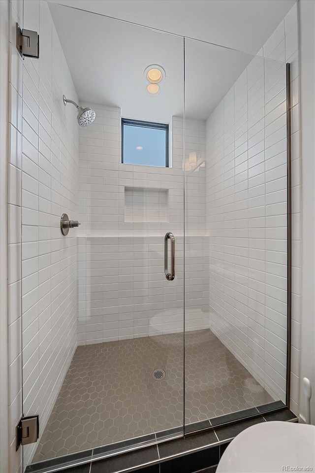 full bathroom featuring a shower stall