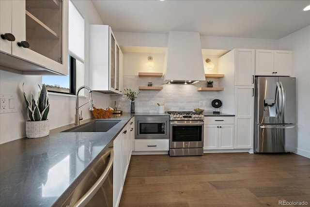 kitchen featuring open shelves, dark wood-style flooring, appliances with stainless steel finishes, custom exhaust hood, and a sink